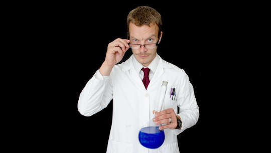 How Authority Wanes: Lack of Knowledge or Incurable Disease? medical practitioner holding a beaker of blue liquid