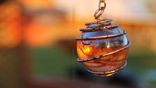 Believe In Your Own Beauty a glowing orb in a pendant with a copper wire wrap