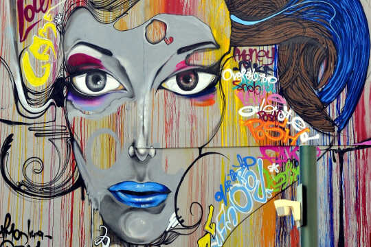 Which 3 R's Really Lead to Happiness and Success? Street art graffiti of a woman's face