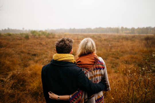 Wish To Keep Love Alive? Here's How... couple looking out at a bare grassy field