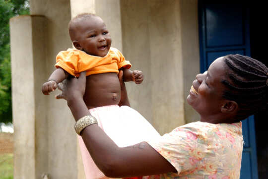 Accessing Life Purpose: From the Womb Onward mother holding up a baby