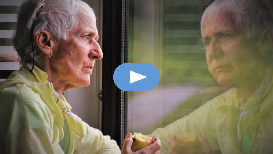 What Getting Old Really Feels Like For Some older person eating an apple and looking at her reflection in a window