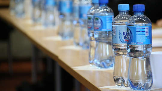 Why Plastic Needs To Be Used Very Sparingly plastic bottles lined up on a counter