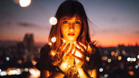 How to Access Higher Wisdom woman holding fireflies