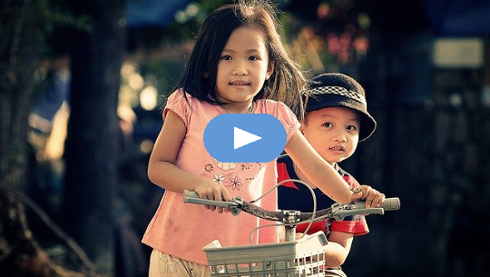 Understanding the Challenges of Our Life’s Journey young girl on bike carrying her young brother behind her