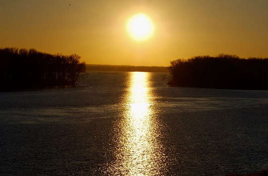 A Place of Rest from Ever-Accelerating Change sun shining over the calm waters