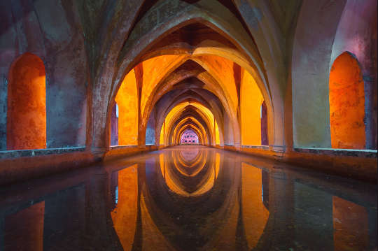 Selfishness in a Monastery: Leadership Lessons from a Monk and His Brother arches reflected in water
