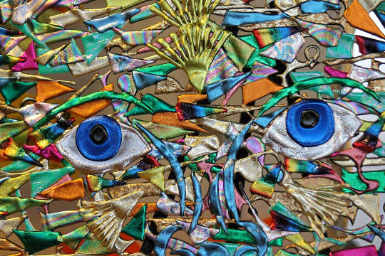 Contrary Winds and the Value of Spirituality abstract artwork of a face with two blue saucer eyes