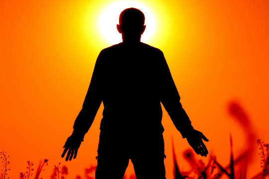 Let Your Body Be Your Guide silhouette of a fan facing the sun