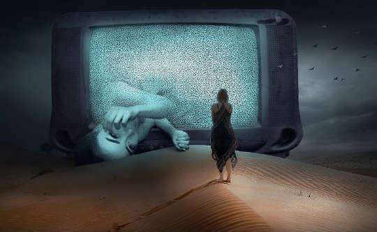 Is Our Modern World Really Unmagical? a tv screen in the desert with a woman standing in front and another half-way out of the screen