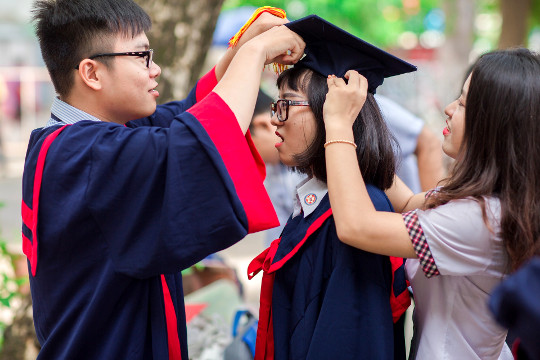 Why Practice Being Happy for the Success of Others graduate with friends