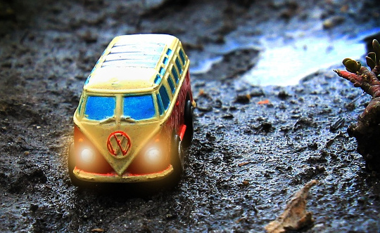 Almost Losing Our VW Van --And Then Another Miracle yellow Volkswagen van on a wet mountain terrain