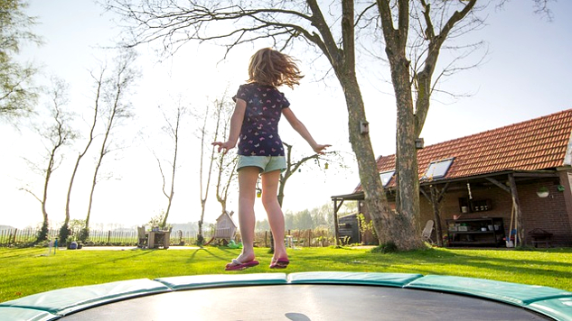 Trampoline Exercises: Bounce Your Way Back to Immune Health young girl jumping on a trampoline