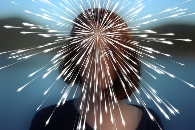 A Part of You Knows Everything a woman's face with rays of light coming from her third eye