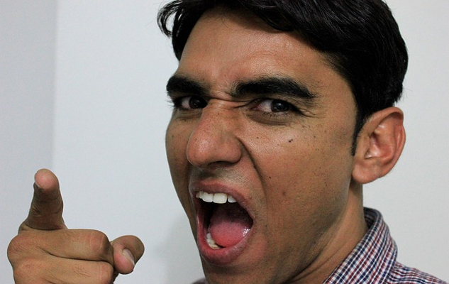 Pointing Fingers or Owning Up: The Choice Between Blame and Responsibility an angry man pointing a finger