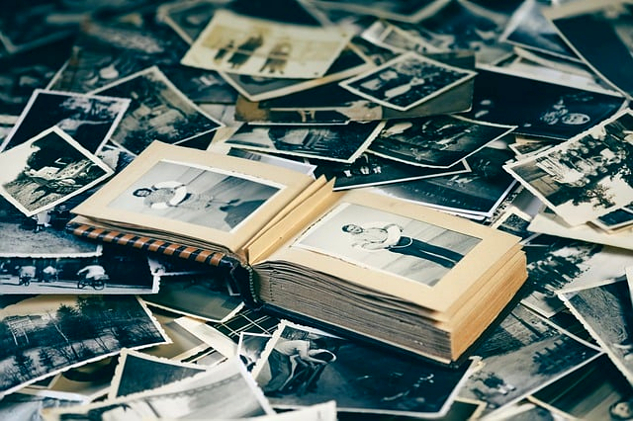 The Cosmic Memory Bank: A Universe of Memories and Insights a bunch of old photos and a book containing old photoes