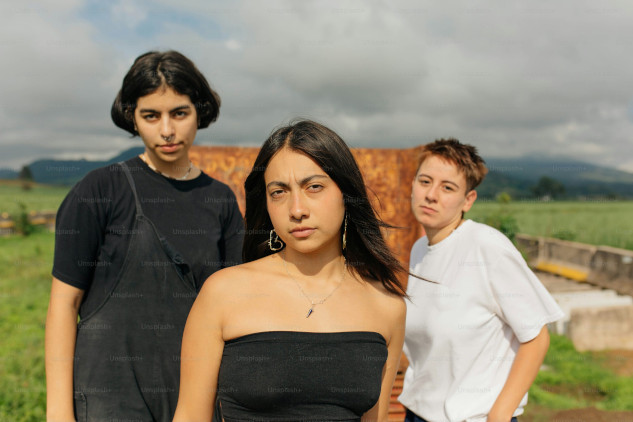 Is Your Partner Receiving Attention From Others? Couple facing each other with an onlooker showing interest in one partner, highlighting the impact of unwanted attention on relationships