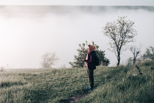 Reclaiming Italian Witchcraft, Magic, and Folk Medicine a woman wearing a scarf standing on a hillside