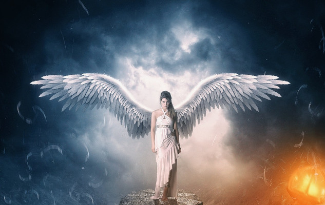 Angelic Light Language: Healing Through Sacred Sounds an angel with wings open wide with light radiating all around