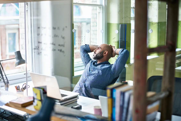7 Ways to Avoid Misinformation Spread A person pausing before sharing something online, symbolizing the importance of thinking before spreading information.