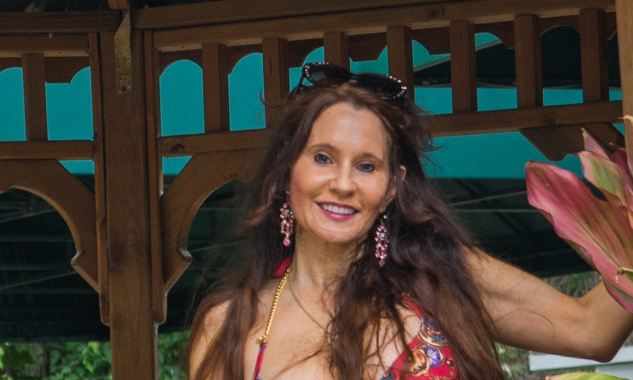 Taoist Hair Care Secrets for Beautiful, Healthy Hair woman with long beautiful hair standing in a gazebo