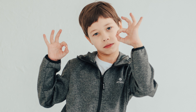 Why Kindness is the Best Gift A young boy making the sign for OK with both hands. Image by Victoria from Pixabay.